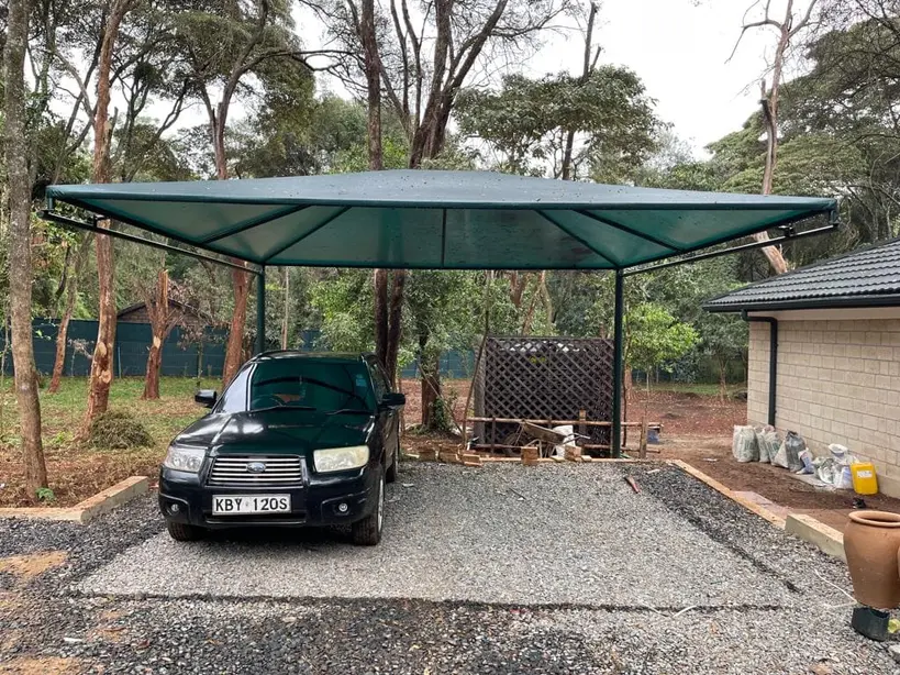 ShadePro car parking shade structure providing UV protection for vehicles in outdoor parking area.